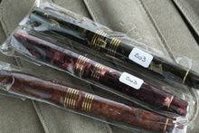 Load image into Gallery viewer, Side view of the dark orange, crimson, and green fountain pens in their sealed sleeves.