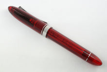 Load image into Gallery viewer, Side view of the red rollerball pen with the cap on.