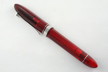 Load image into Gallery viewer, Side view of the red rollerball pen with the cap on.