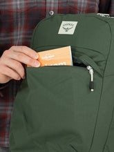 Load image into Gallery viewer, A person tucking a guide book into the front panel pocket.