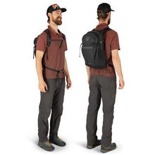 Load image into Gallery viewer, Angled front and back views of a young man carrying the black backpack.