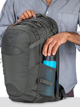 Load image into Gallery viewer, A man sliding a water bottle on the side panel's pocket