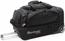 Load image into Gallery viewer, Angled side view of the black wheeled duffle bag with the telescopic handle extended.