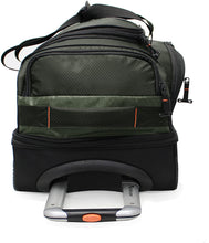 Load image into Gallery viewer, Top panel view of the green wheeled duffle bag. It features a grab handle and a telescopic handle.