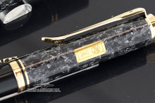 Load image into Gallery viewer, Close up to the side of the ballpoint pen. Featuring a yellow decal with the Pelikan logo and 24C.