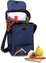 Load image into Gallery viewer, Blue insulated wine and cheese cooler tote with a collection of wine bottles, a corkscrew, a cheese knife, and a cutting board laid out next to it.