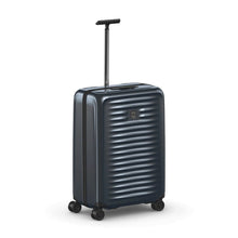 Load image into Gallery viewer, Angled front view of the dark blue suitcase with the telescopic handle extended.