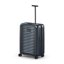 Load image into Gallery viewer, Angled front view of the dark blue suitcase with the telescopic handle extended.