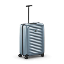 Load image into Gallery viewer, Angled front view of the light blue suitcase with the telescopic handle extended.