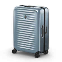 Load image into Gallery viewer, Angled front view of the light blue suitcase with the telescopic handle retracted.