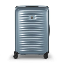 Load image into Gallery viewer, Front panel view of the light blue suitcase with the telescopic handle retracted.