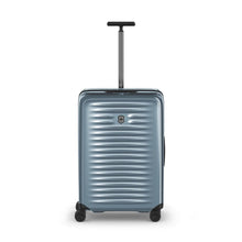 Load image into Gallery viewer, Front panel view of the light blue suitcase with the telescopic handle extended.