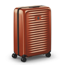Load image into Gallery viewer, Angled front view of the orange suitcase with the telescopic handle retracted.