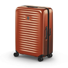 Load image into Gallery viewer, Angled front view of the orange suitcase with the telescopic handle retracted.