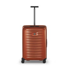 Load image into Gallery viewer, Front panel view of the orange suitcase with the telescopic handle extended.