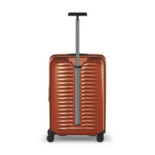Load image into Gallery viewer, Back panel view of the orange suitcase with the telescopic handle extended.