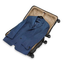 Load image into Gallery viewer, Briggs & Riley Torq Medium Hardside Spinner Luggage - Black
Image of Built-in mesh suiter with removable, adjustable foam roll bar neatly holds two suits or garments or 1-4 shirts and cinches them securely in place to prevent wrinkling; orange tabs indicate adjustable components.
Dimensions: 27.5"H x 18.5"W x 11.5"D
Weight:         8.9 lbs.