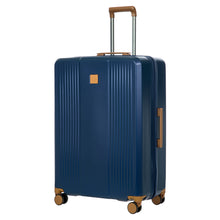 Load image into Gallery viewer, Front angled view of the blue suitcase on a white background. The telescopic handle is pulled up.