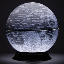 Load image into Gallery viewer, Front view of the lighted globe on a dark background.