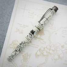 Load image into Gallery viewer, Side view of the 100 Aker Woood fountain pen laying on a print.