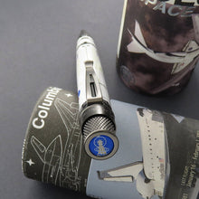 Load image into Gallery viewer, Angled top disk view of the pen leaning on the gift tube.