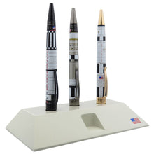Load image into Gallery viewer, Th launch pad with three pens arranged in it.