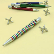 Load image into Gallery viewer, Angled view of the Origin pen with a red, green, and blue lacquer set of pens behind it.