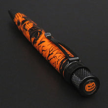 Load image into Gallery viewer, Angled top view of the pen on a dark gray background.