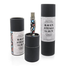 Load image into Gallery viewer, The Raven Steals the Sun pen arranged with two gift tubes on a white background.