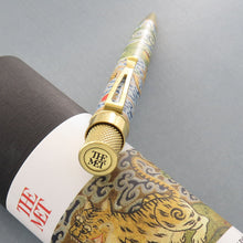 Load image into Gallery viewer, Angled top disk view of the pen, featuring THE MET logo.