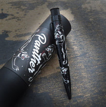 Load image into Gallery viewer, Side view of the Panther rollerball pen leaning on the matching gift tube.