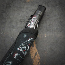 Load image into Gallery viewer, Close up to the rollerball pen inside the matching panther sleeve.