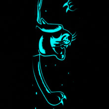 Load image into Gallery viewer, Close up to a panther face glowing in the dark.