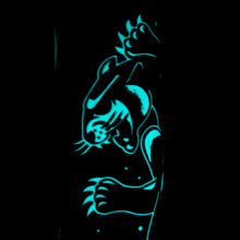 Load image into Gallery viewer, Close up to a panther face glowing in the dark.