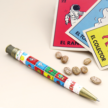 Load image into Gallery viewer, Back view of the loteria pen arranged with beans and cards on a white background.