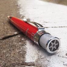 Load image into Gallery viewer, Angled top disk view of the pen, the design is a tire rim.