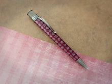 Load image into Gallery viewer, Side view of the Retro 51 Vintage Metalsmith Harriet Tubman Rollerball Pen (VRR-2250). The has a wine red color with the white dot texture of a scarf she owned. The trims are antique silver colored.