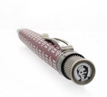 Load image into Gallery viewer, Angled view of the Retro 51 Harriet Tubman Rollerball Pen showing the disk. It has a portrait icon of Harriet Tubman.