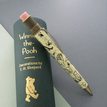 Load image into Gallery viewer, Side view of the pencil leaning on a green gift tube.