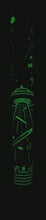 Load image into Gallery viewer, Stock image of the Tuesday pen glowing in the dark.
