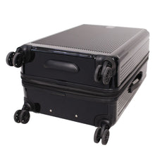 Load image into Gallery viewer, Bottom panel close up on the black suitcase. It features four spinner wheels, and a grip handle.
