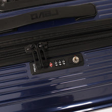 Load image into Gallery viewer, Close up to the blue suitcase's top panel, featuring a grip handle, and a TSA approved, three-digit combination lock.