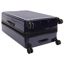 Load image into Gallery viewer, Bottom view of the navy blue suitcase. It features four spinner wheels, and a grip handle.