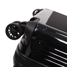 Load image into Gallery viewer, Close up on the black suitcase's spinner wheel.