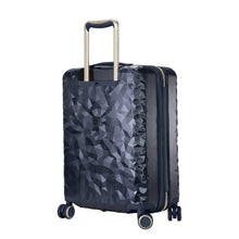 Load image into Gallery viewer, Angled back panel view of the navy blue hard shell suitcase with a geometric pattern.
