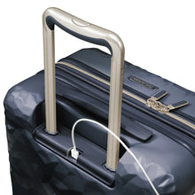 Load image into Gallery viewer, Top panel close up of the navy blue suitcase with a USB type-A cable plugged in the compartment under the handle.