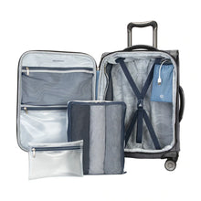 Load image into Gallery viewer, Interior view of the gray suitcase with two packing bags arranged in front.
