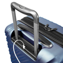 Load image into Gallery viewer, Angled close up to the twilight blue suitcase, with a USB cable connected under the handle.
