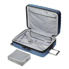 Load image into Gallery viewer, Interior view of the twilight blue hard shell suitcase. It features a packing cube, a zipper-closing panel divider, and adjustable straps with a side-release buckle.