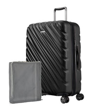 Load image into Gallery viewer, Front angled view of the onyx black hard shell suitcase with a packing cube next to it.